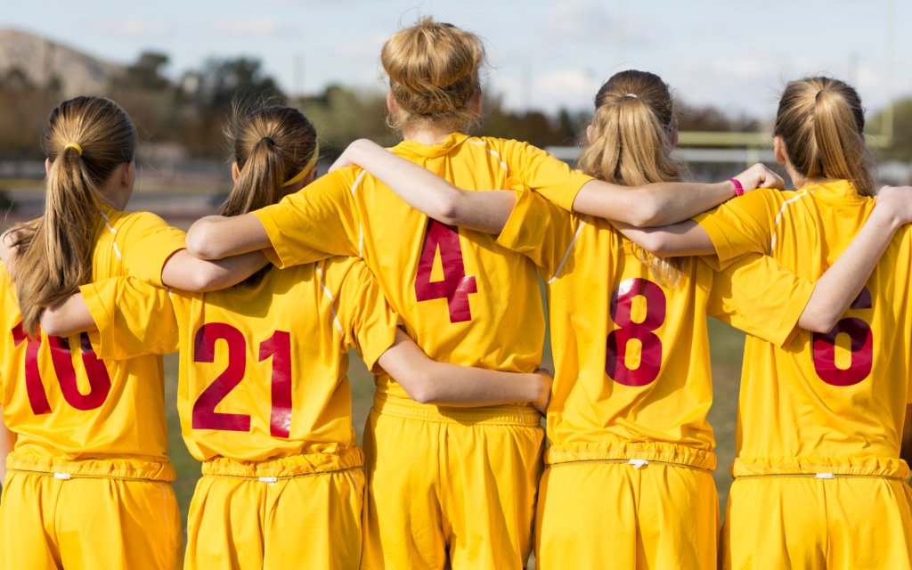 Players from a young soccer club are united with one purpose: Teamwork.